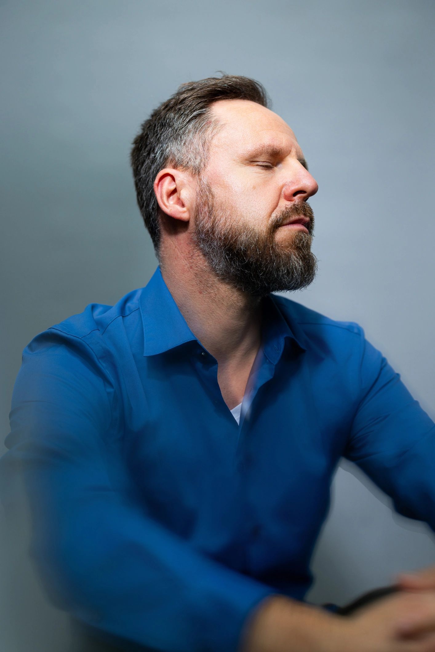 mature male author portrait dark background